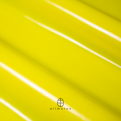 Close-up of yellow glossy latex with Allmotex logo.