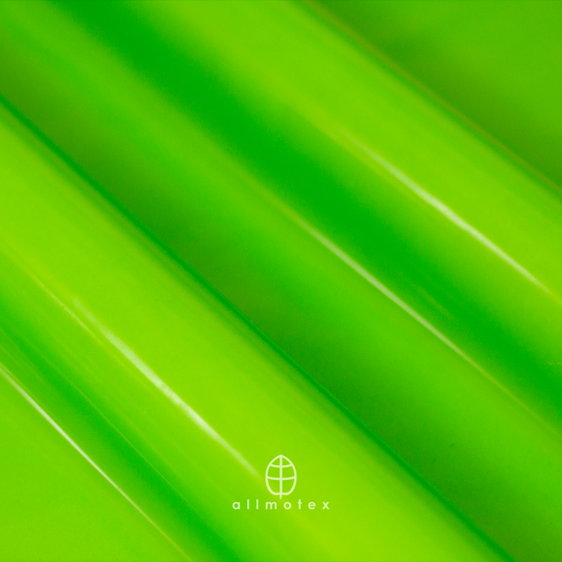 Close-up of green glossy latex with Allmotex logo.