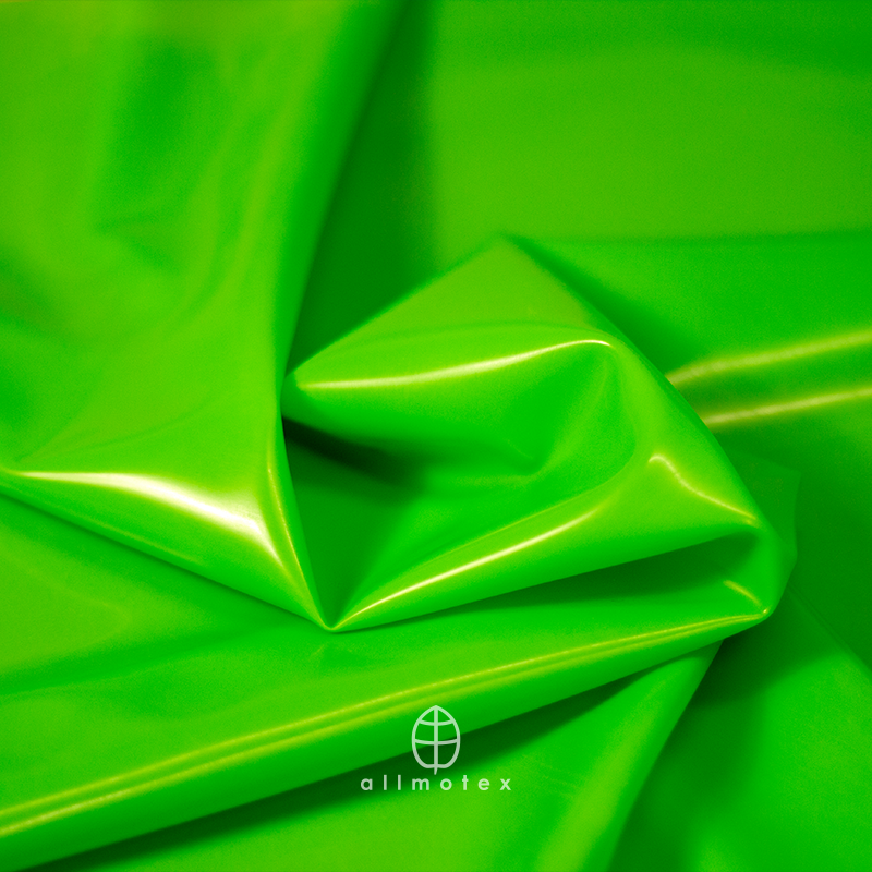 Close-up of green glossy latex with Allmotex logo.